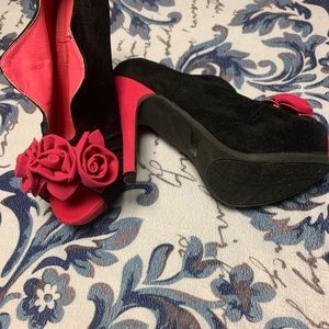 Pink and black heels with rose detailing